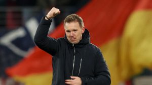 Pelatih Timnas Jerman, Julian Nagelsmann, memperlihatkan ekspresi gembira setelah tim asuhannya berhasil memastikan tiket Piala Dunia 2026 menjadi milik mereka usai kemenangan telak 6-0 atas Slowakia di Red Bull Arena, Leipzig, Selasa (18/11/2025) dini hari WIB. 